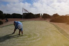Finchy playing golf at Border Village Nullarbor Links