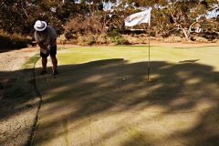 Finchy playing golf at Madura Nullarbor Links