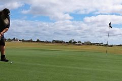 Putting on The Dunes Golf Course