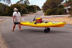 Finchy walking his kayak to the Coffin Bay boat ramp
