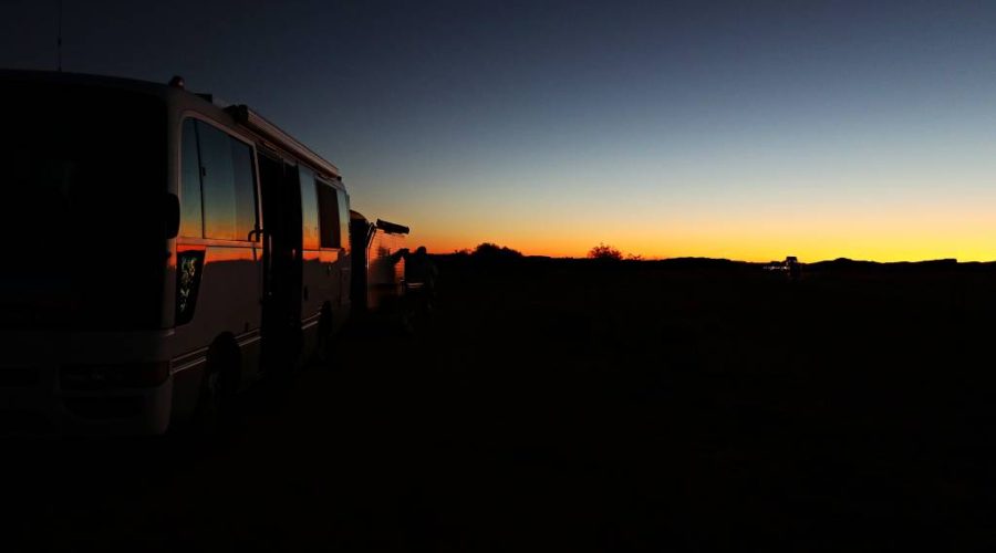 Watching road trains pass by our overnight stop in the Kimberley at sunset