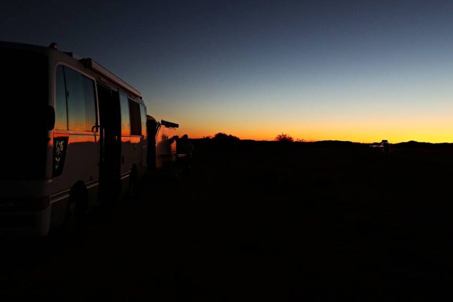 Watching road trains pass by our overnight stop in the Kimberley at sunset