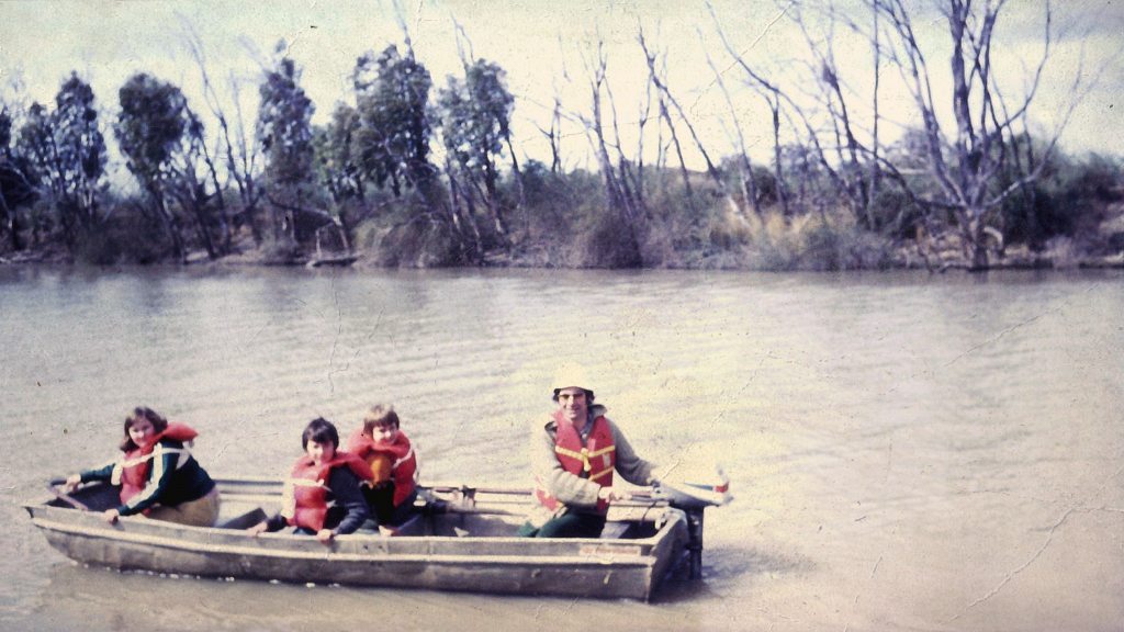 Finchy with his dad and siblings on a Murray River family holiday